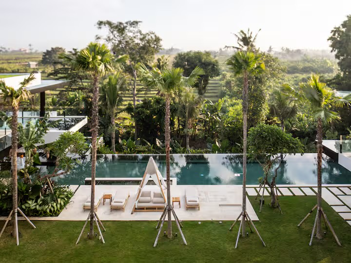 Infinity pool at the villa looking out over Bali rice terraces at dawn