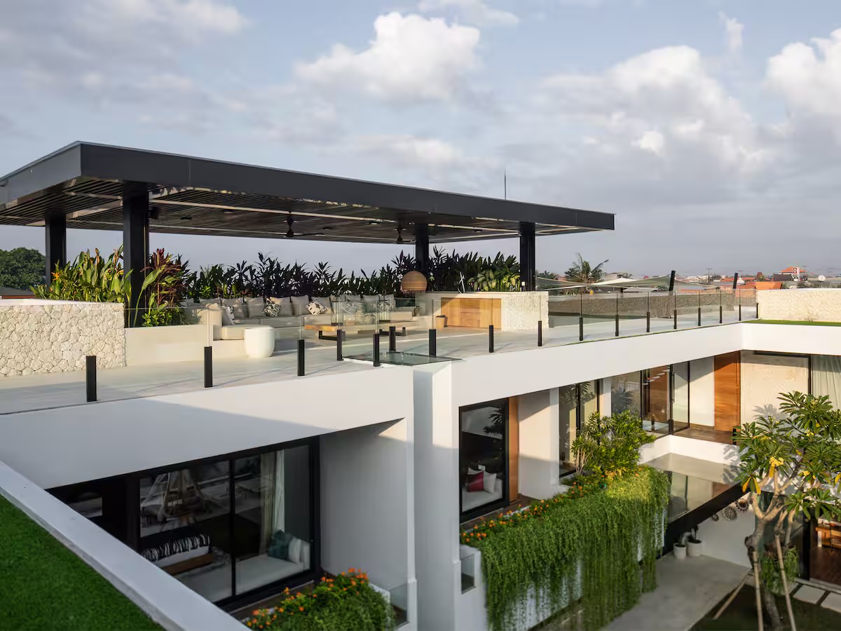 Rooftop terrace with lounge seating under a black pergola