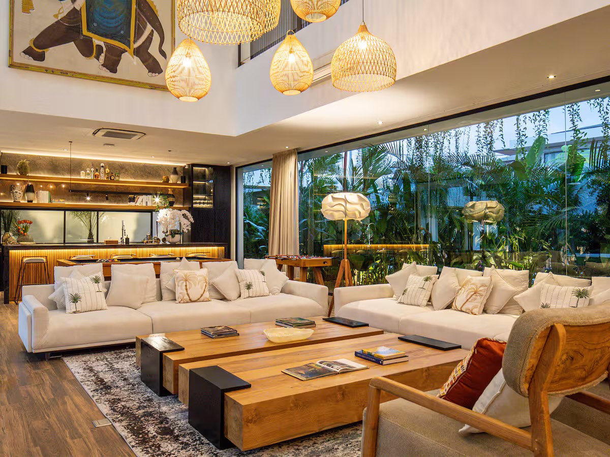 The living room and bar lit warmly in the evening